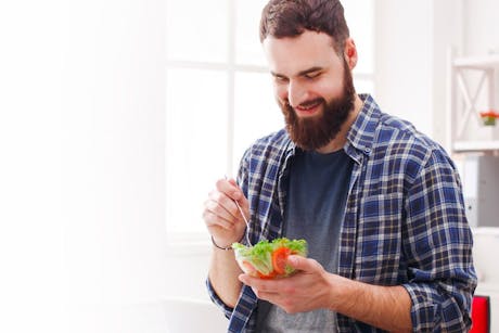 Man eating a salad - Eat better to live better